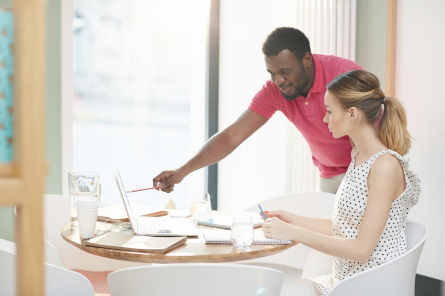 Instructor working with students on real budget automation scenarios